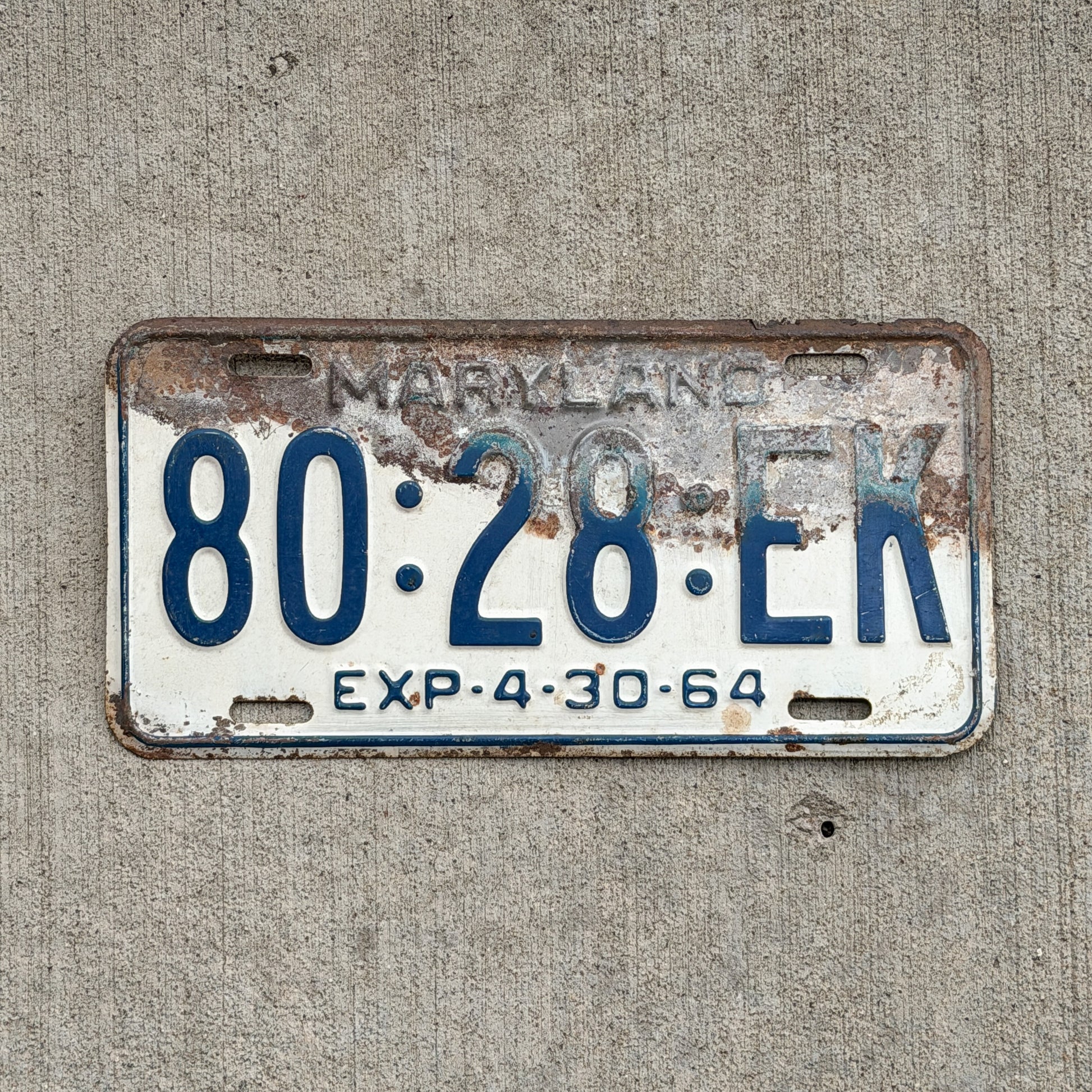 Photo of a 1964 Maryland Truck License Plate Auto Tag Garage Decor Vintage 80 28 EK with original patina