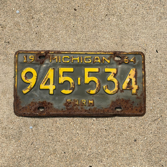 Photo of a 1964 Michigan Farm License Plate Auto Tag Garage Decor Vintage 945 534 with original patina
