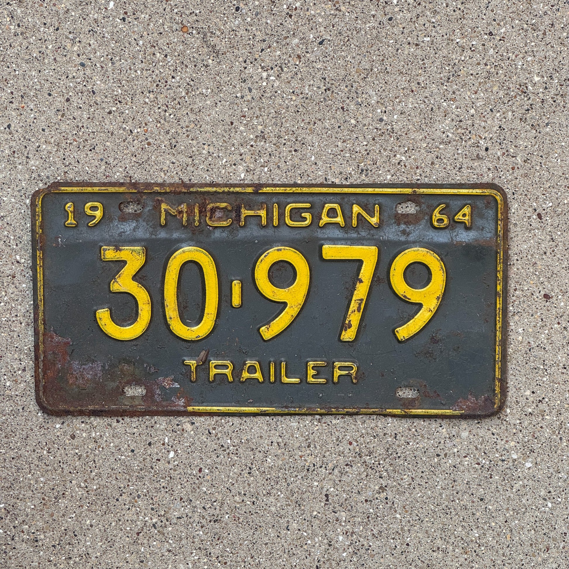 Photo of a 1964 Michigan Trailer License Plate Auto Tag Garage Decor Vintage 30 979