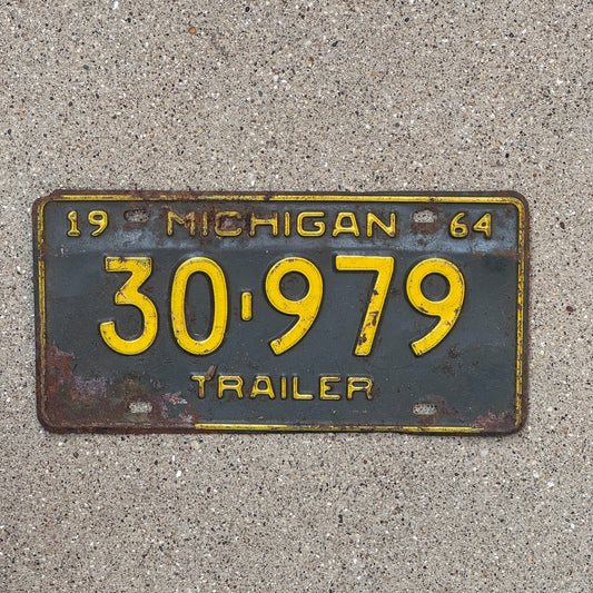Photo of a 1964 Michigan Trailer License Plate Auto Tag Garage Decor Vintage 30 979