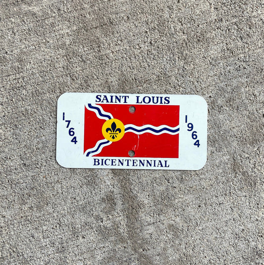 Photo of a 1964 Missouri Motorcycle Booster License Plate Auto Tag Garage Decor Vintage SAINT LOUIS BICENTENNIAL with original patina