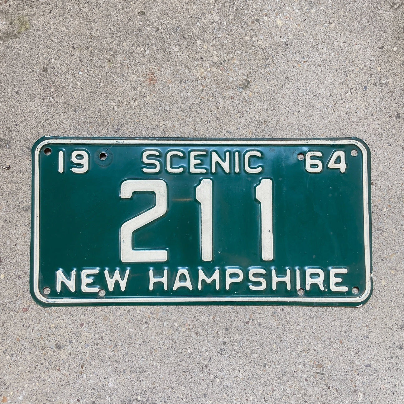 Photo of a 1964 New Hampshire License Plate Auto Tag 1 Garage Decor Low Number Three Digit 211 with original patina