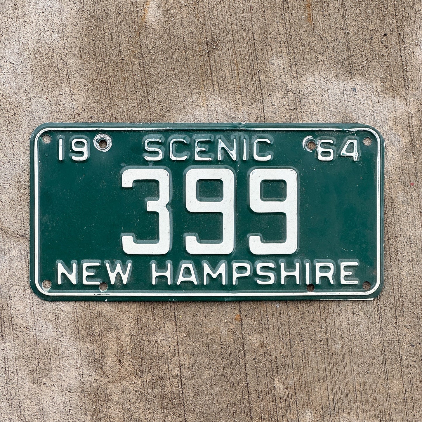 Photo of a 1964 New Hampshire License Plate Auto Tag 2 Vintage Garage Low Number Three Digit 399 with original patina