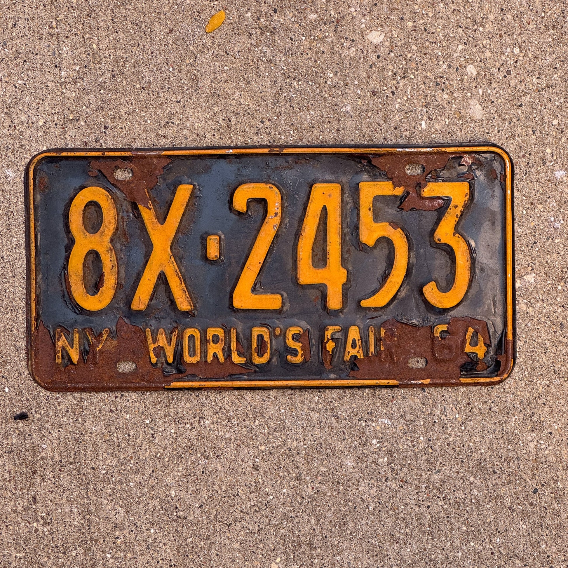 Photo of a 1964 New York License Plate Auto Tag Garage Decor Vintage 8X 2453 with original patina
