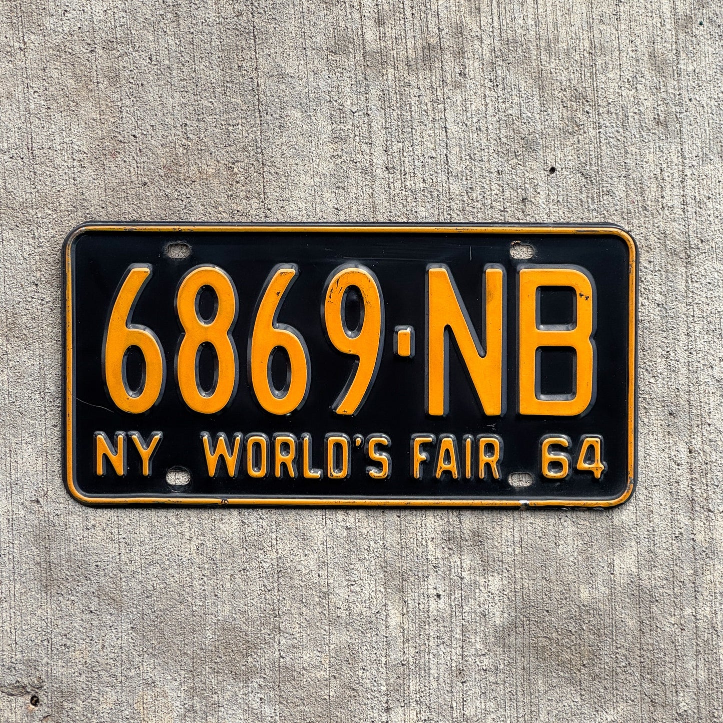 Photo of a 1964 New York License Plate Auto Tag Garage Decor Vintage DMV Clear Single Plate Year 6869 NB with original patina
