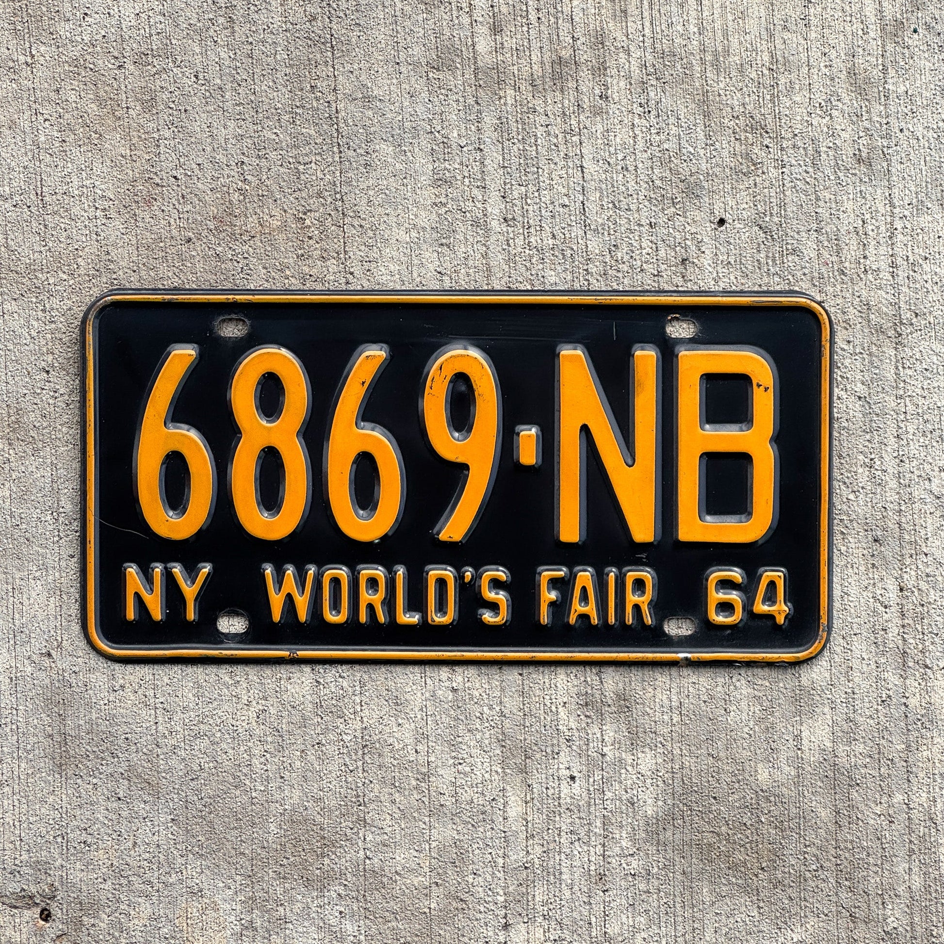 Photo of a 1964 New York License Plate Auto Tag Garage Decor Vintage DMV Clear Single Plate Year 6869 NB with original patina