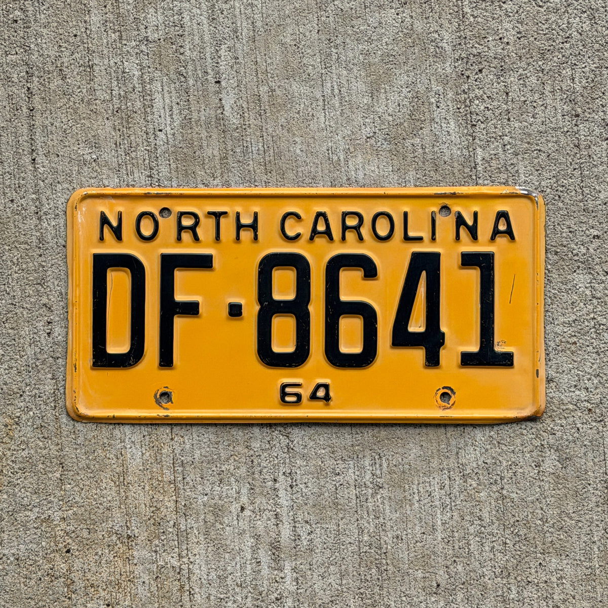 Photo of a 1964 North Carolina License Plate Auto Tag Garage Decor Vintage DF 8641 with original patina