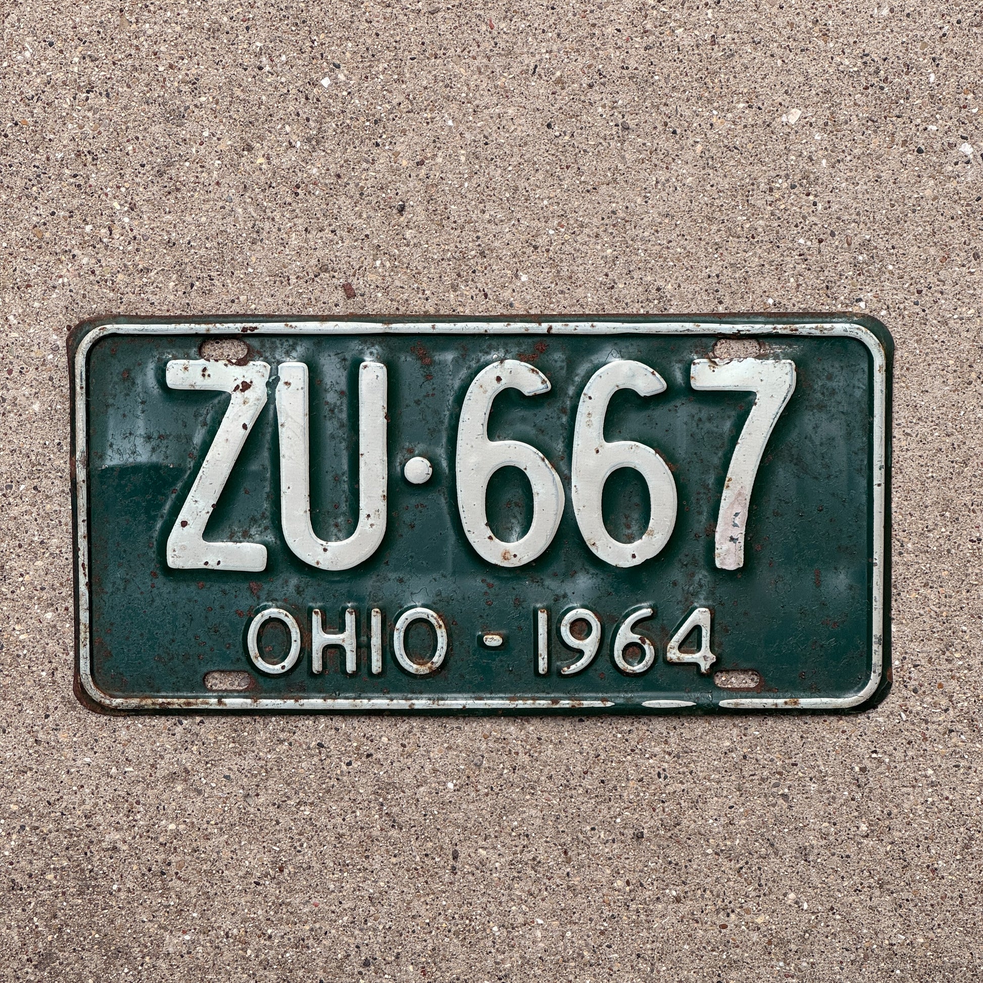 Photo of a 1964 Ohio License Plate Auto Tag Garage Decor Vintage ZU 667 with original patina