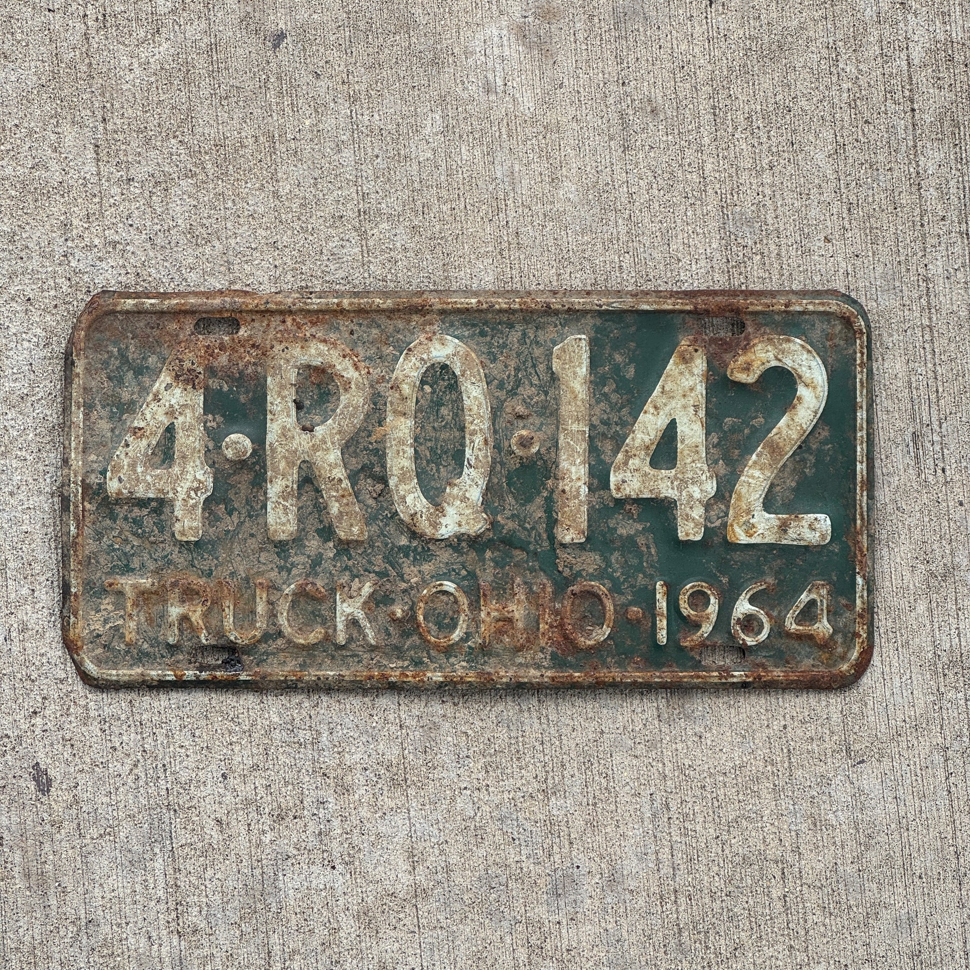 Photo of a 1964 Ohio Truck License Plate Auto Tag Garage Decor Vintage 4 RQ 142 with original patina