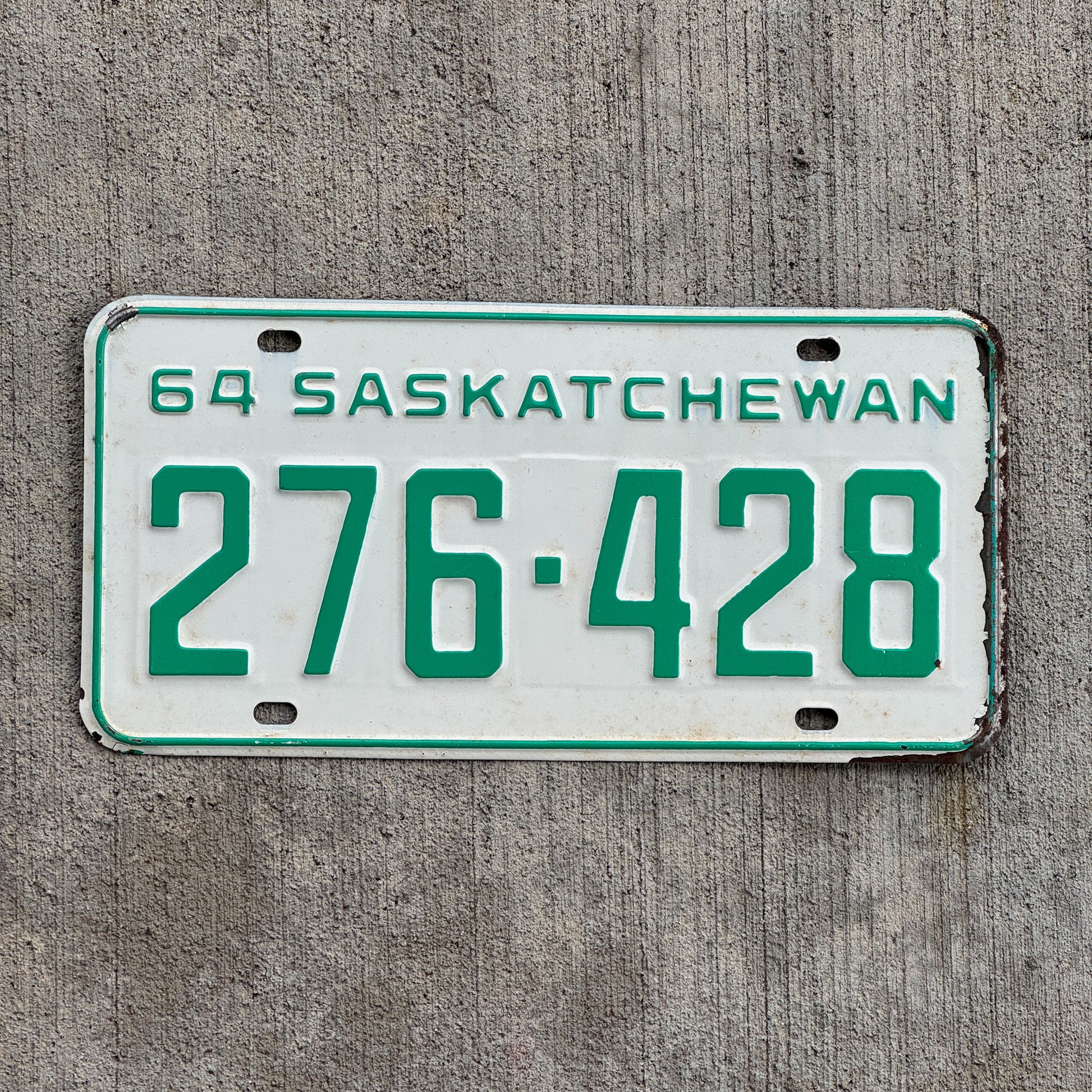 Photo of a 1964 Saskatchewan License Plate Auto Tag Garage Decor Vintage 276 428 with original patina