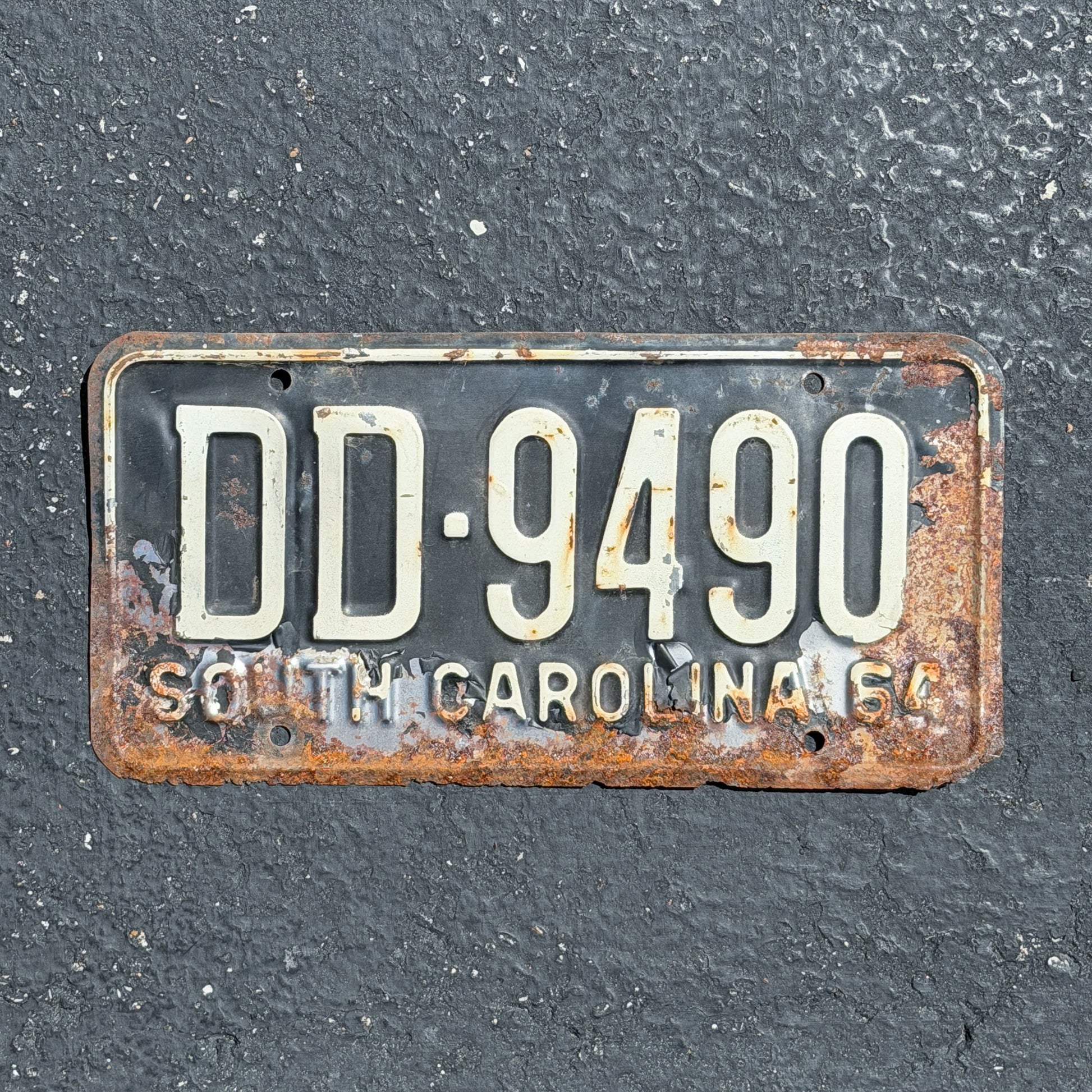 Photo of a 1964 South Carolina License Plate Auto Tag Garage Decor Vintage DD 9490 with original patina