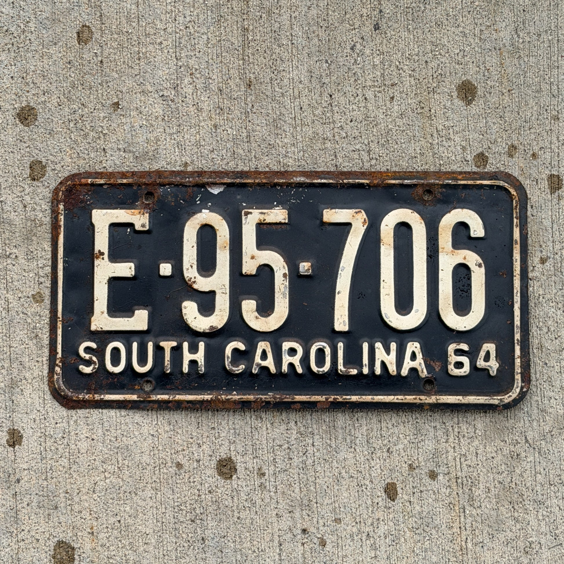 Photo of a 1964 South Carolina License Plate Auto Tag Garage Decor Vintage E 95 706 with original patina