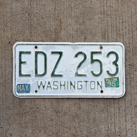 Photo of a 1965 1985 Washington License Plate Auto Tag Garage Decor Vintage YOM DMV Clear Number EDZ 253 with original patina