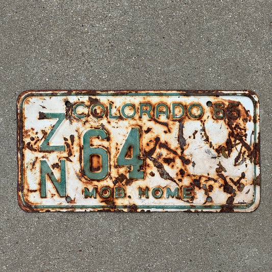 Photo of a 1965 Colorado Mobile Home License Plate Auto Tag Garage Decor Vintage ZN 64