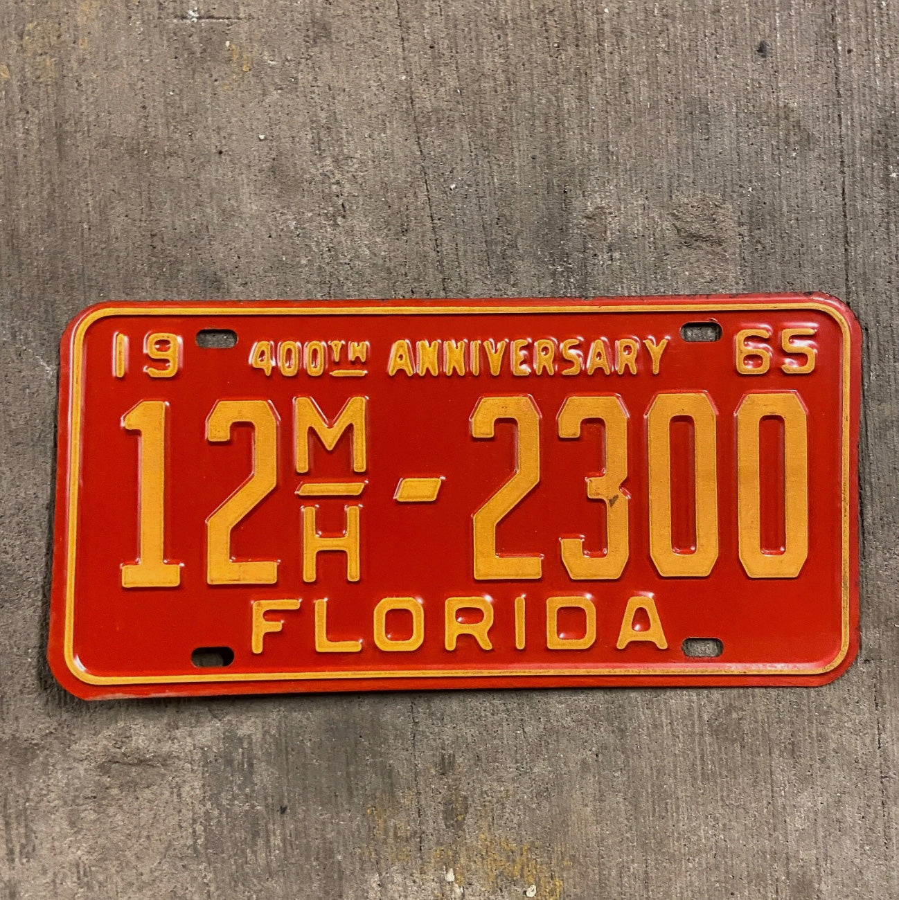 Photo of a 1965 Florida Mobile Home License Plate Auto Tag Garage Decor Vintage 12 MH 2300 with original patina
