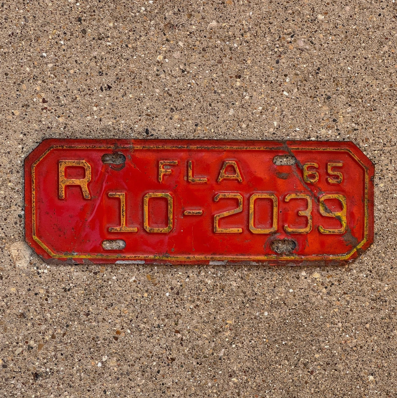 Photo of a 1965 Florida Motorcycle License Plate Auto Tag Garage Decor Vintage 10 2039 with original patina