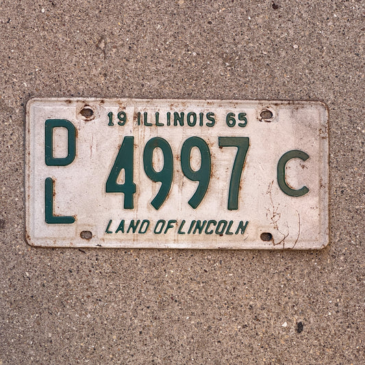 Photo of a 1965 Illinois Dealer License Plate Auto Tag 1 Vintage Garage 4997 C with original patina