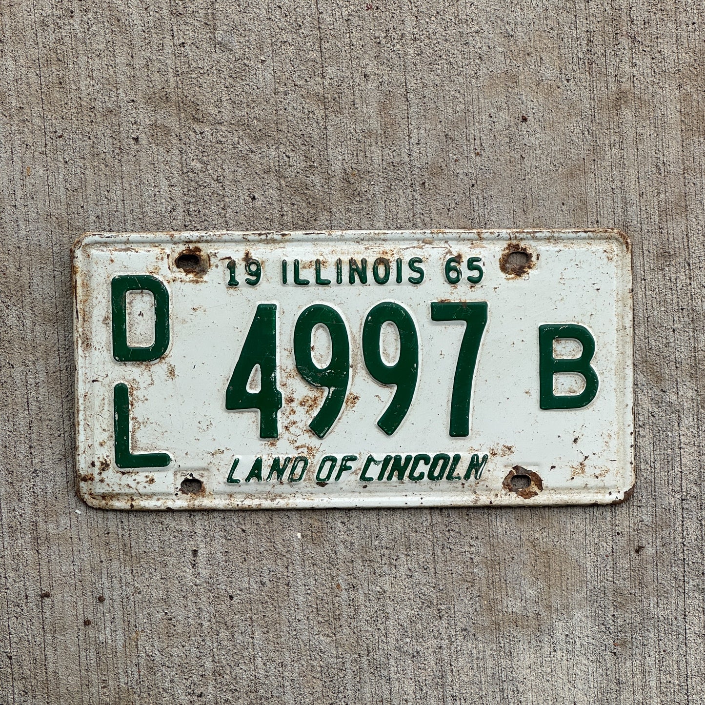 Photo of a 1965 Illinois Dealer License Plate Auto Tag 2 Vintage Garage 4997 B with original patina