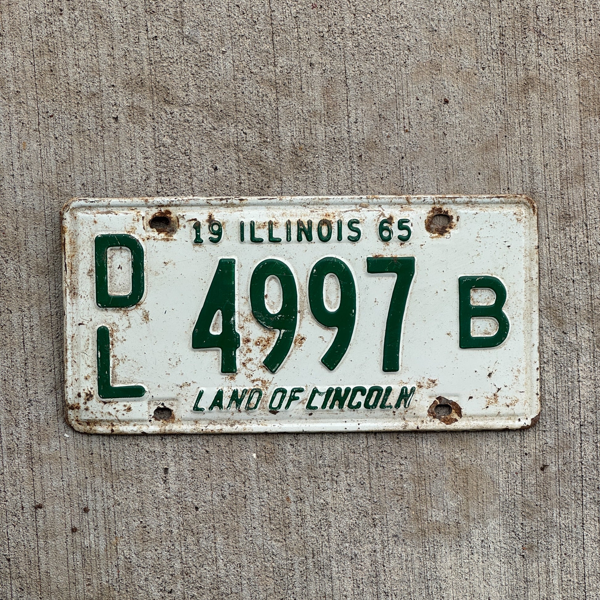 Photo of a 1965 Illinois Dealer License Plate Auto Tag 2 Vintage Garage 4997 B with original patina
