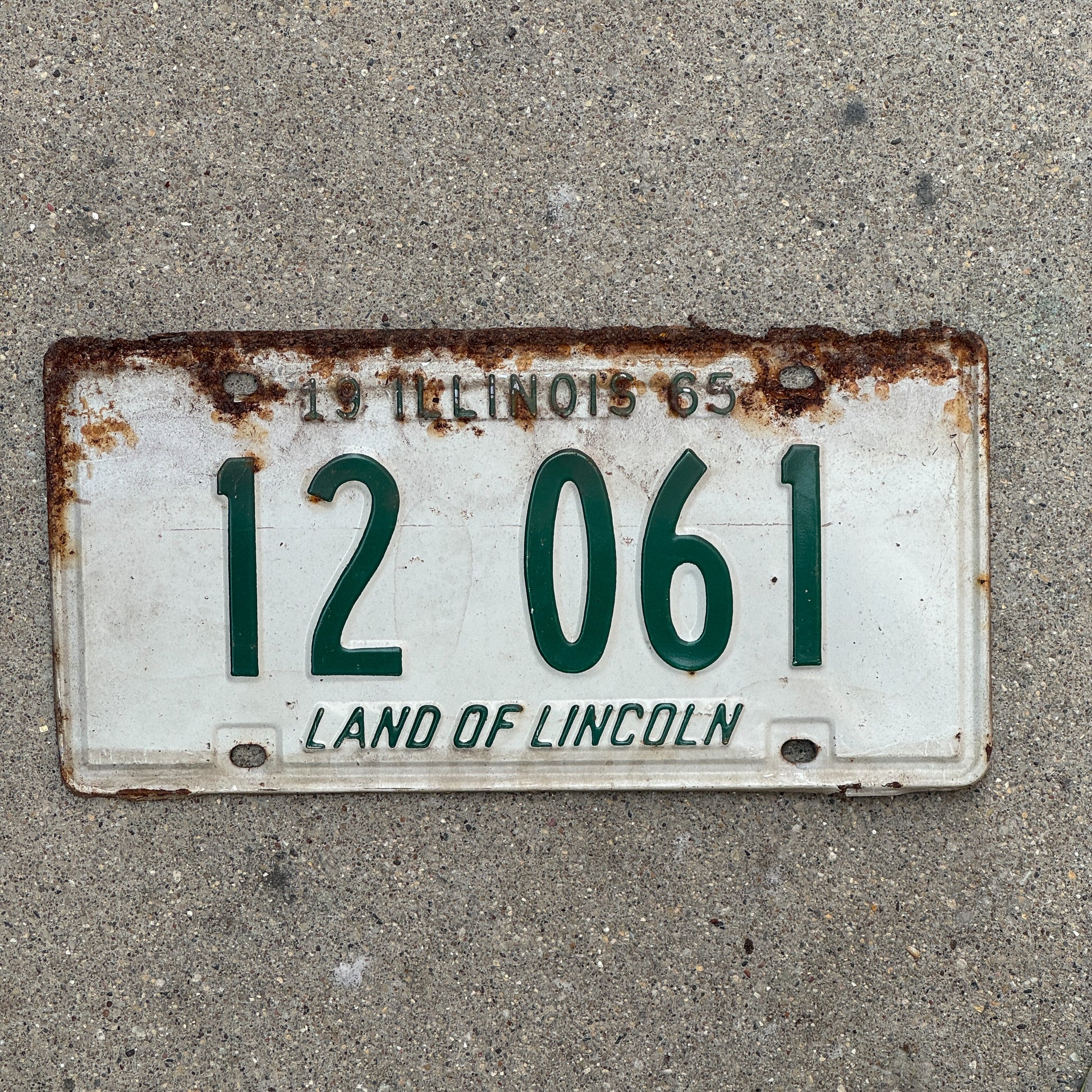 Photo of a 1965 Illinois License Plate Auto Tag 1 Vintage Garage 12 061 with original patina