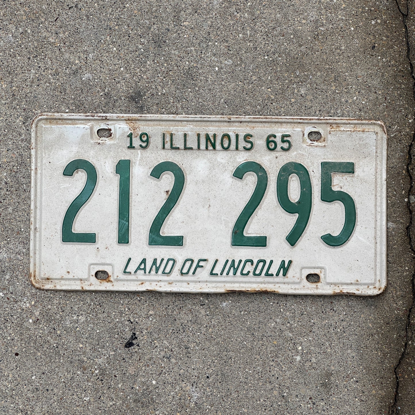 Photo of a 1965 Illinois License Plate Auto Tag 1 Vintage Garage 212 295 with original patina