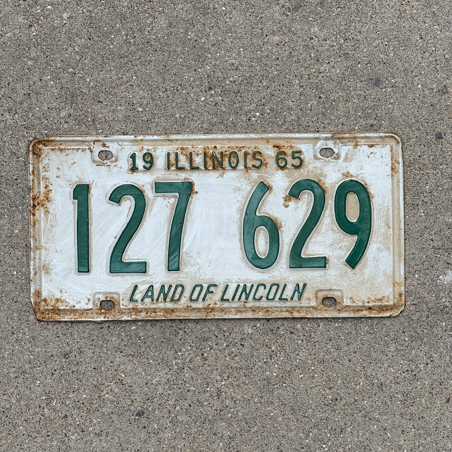 Photo of a 1965 Illinois License Plate Auto Tag 2 Vintage Garage 127 629 with original patina
