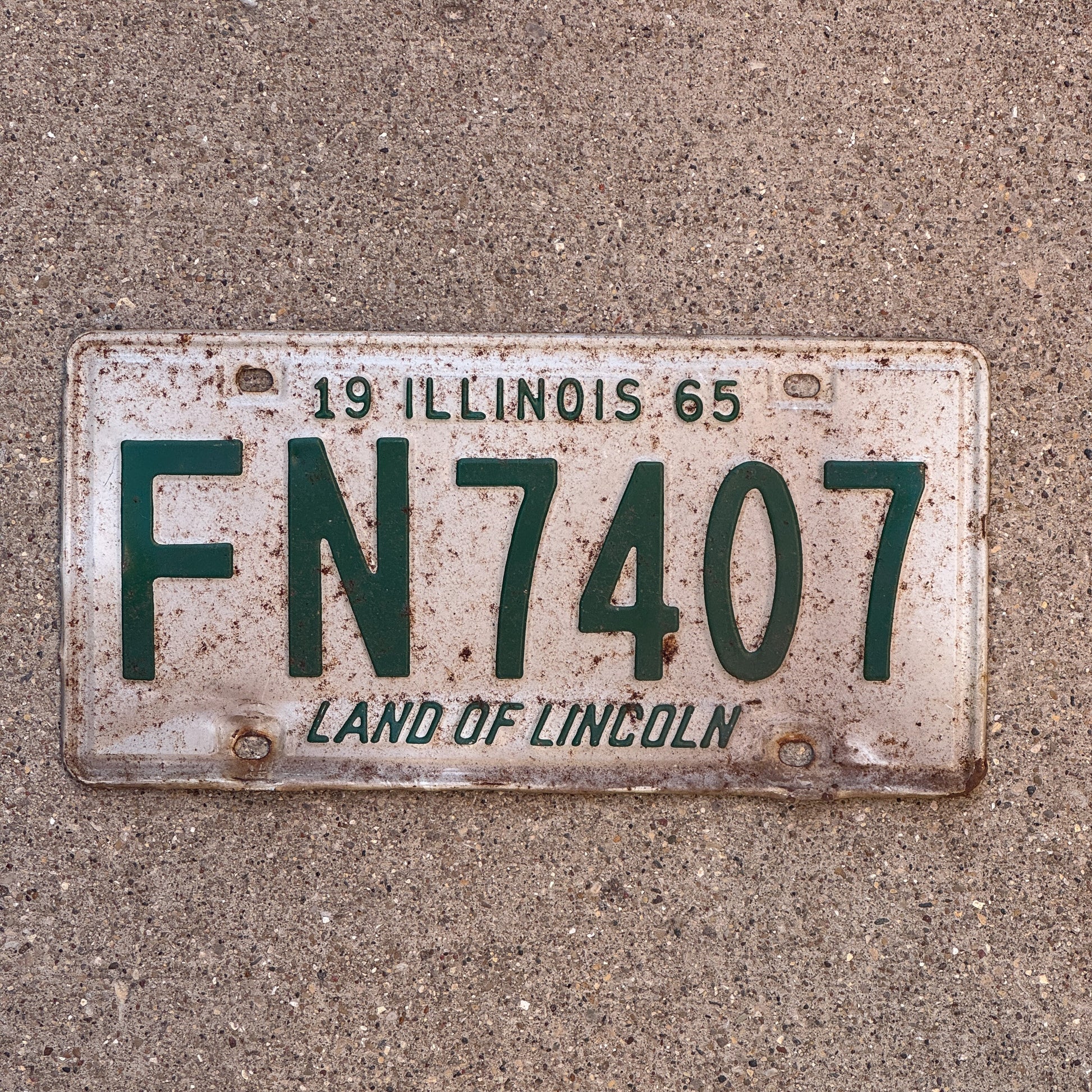 Photo of a 1965 Illinois License Plate Auto Tag Garage Decor Vintage FN 7407 with original patina