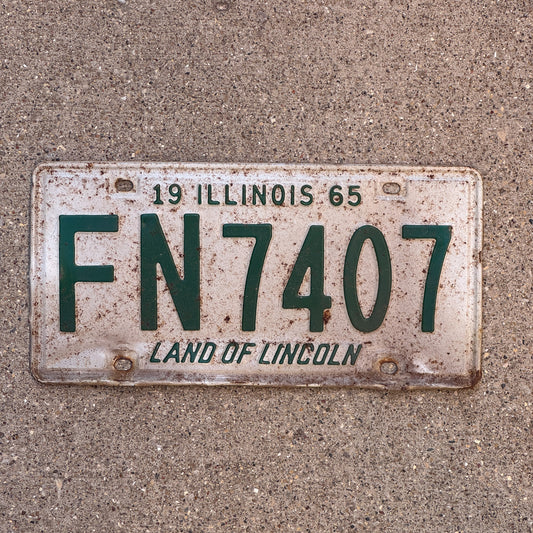 Photo of a 1965 Illinois License Plate Auto Tag Garage Decor Vintage FN 7407 with original patina