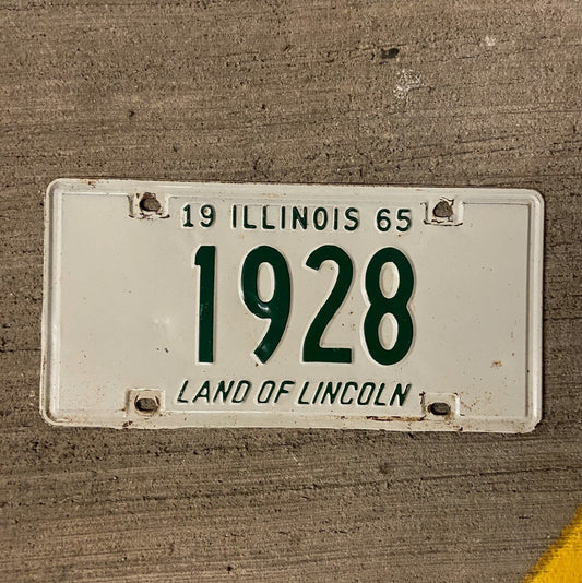 Photo of a 1965 Illinois License Plate Auto Tag Garage Decor Vintage Low Number Four Digit 1928 with original patina