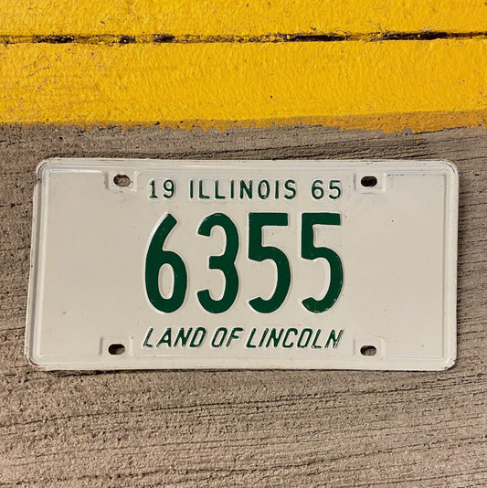 Photo of a 1965 Illinois License Plate Auto Tag Garage Decor Vintage Low Number Four Digit 6355 with original patina