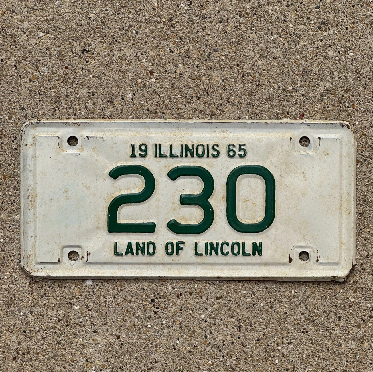 Photo of a 1965 Illinois Motorcycle License Plate Auto Tag Garage Decor Vintage Low Number Three Digit 230 with original patina