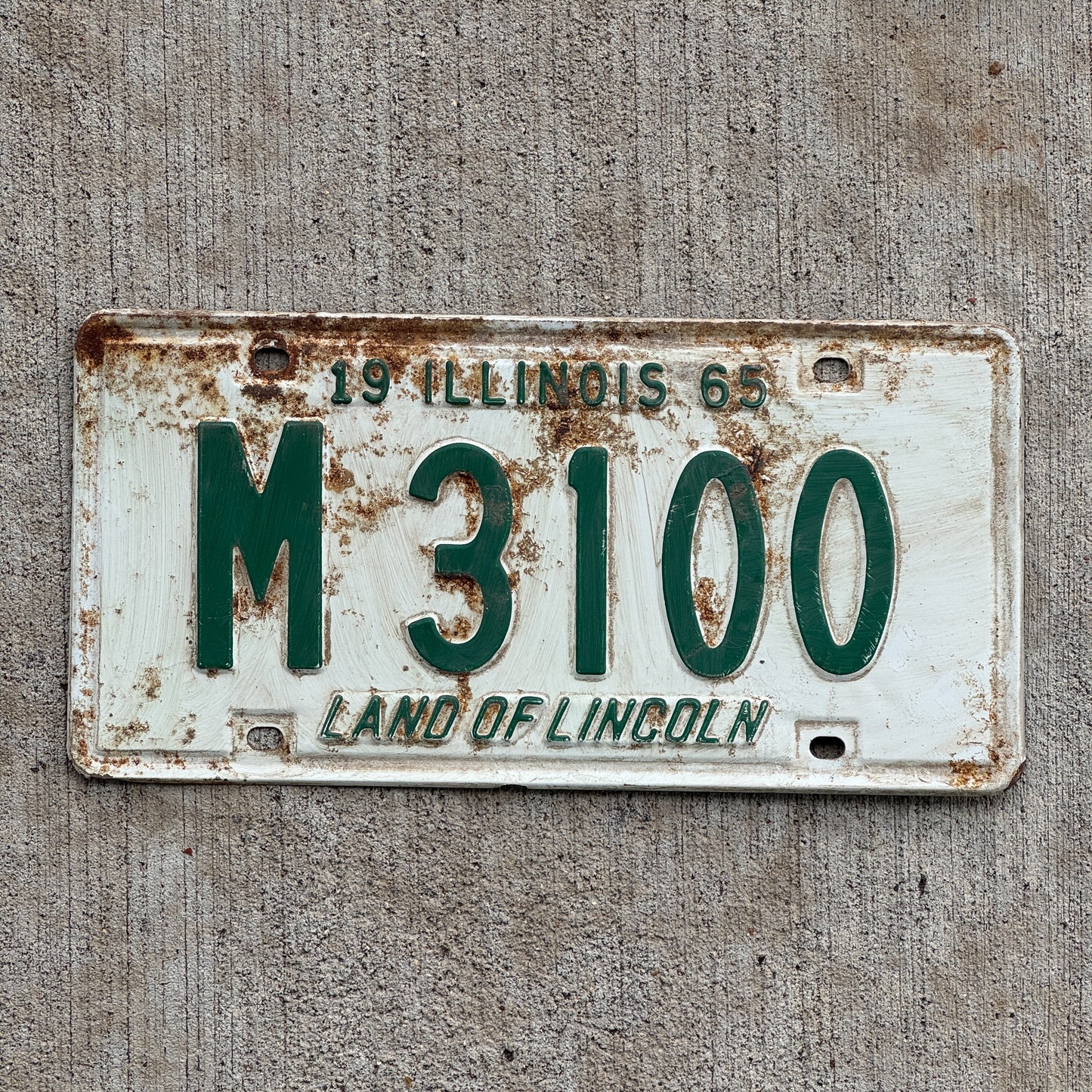 Photo of a 1965 Illinois Municipal License Plate Auto Tag 1 Vintage Garage M 3100 with original patina