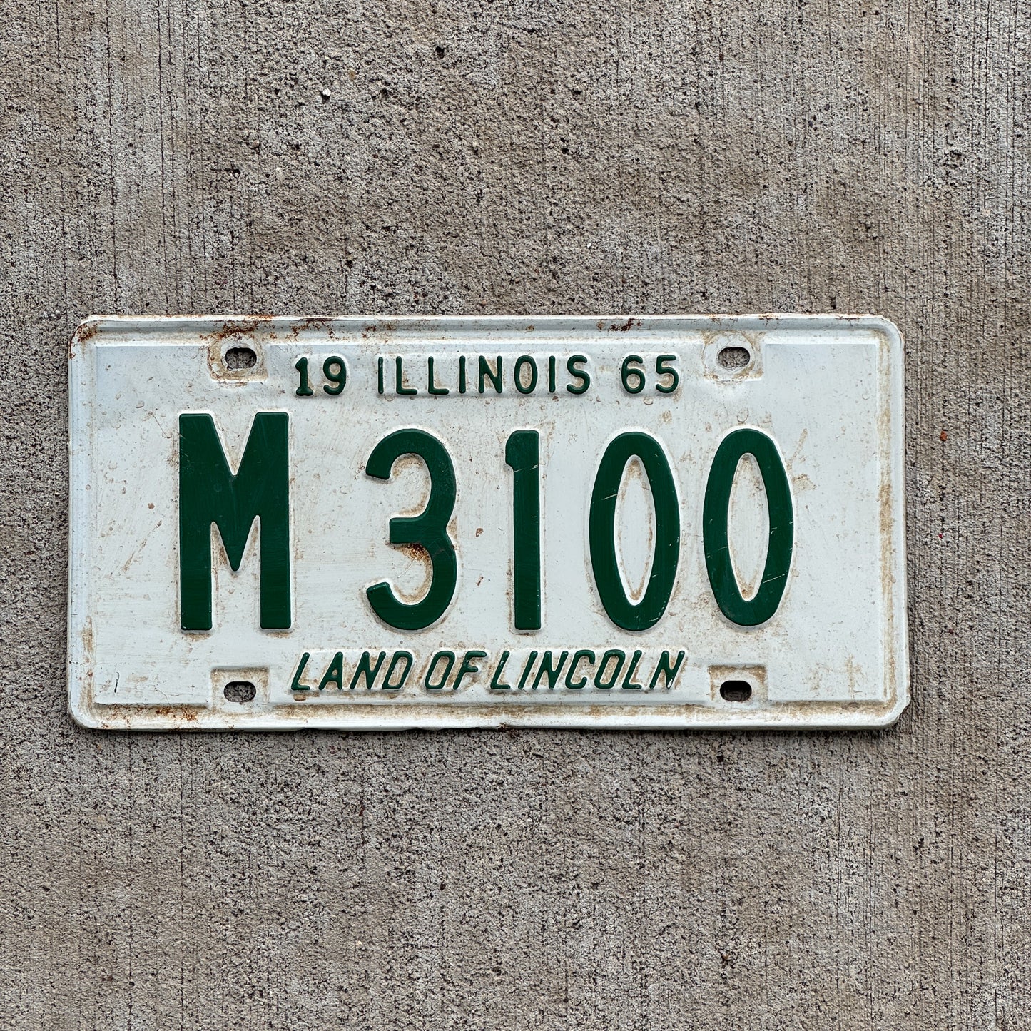 Photo of a 1965 Illinois Municipal License Plate Auto Tag 2 Vintage Garage M 3100 with original patina
