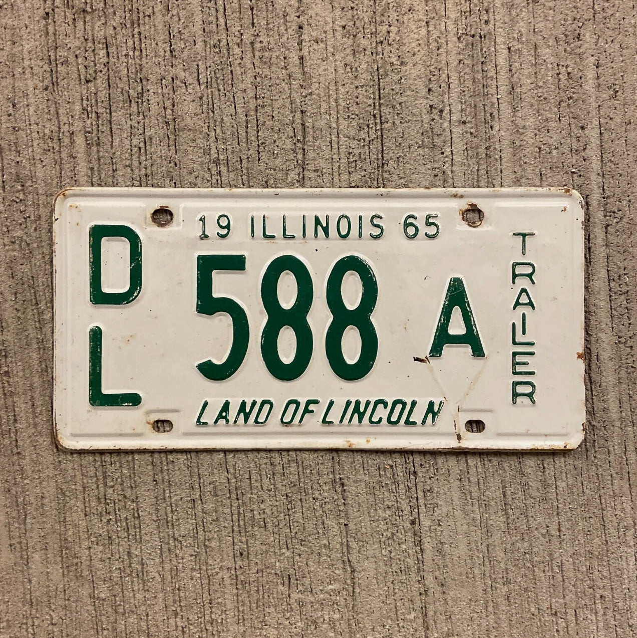 Photo of a 1965 Illinois Trailer Dealer License Plate Auto Tag Garage Decor Vintage Hard to Find Type 588 A with original patina