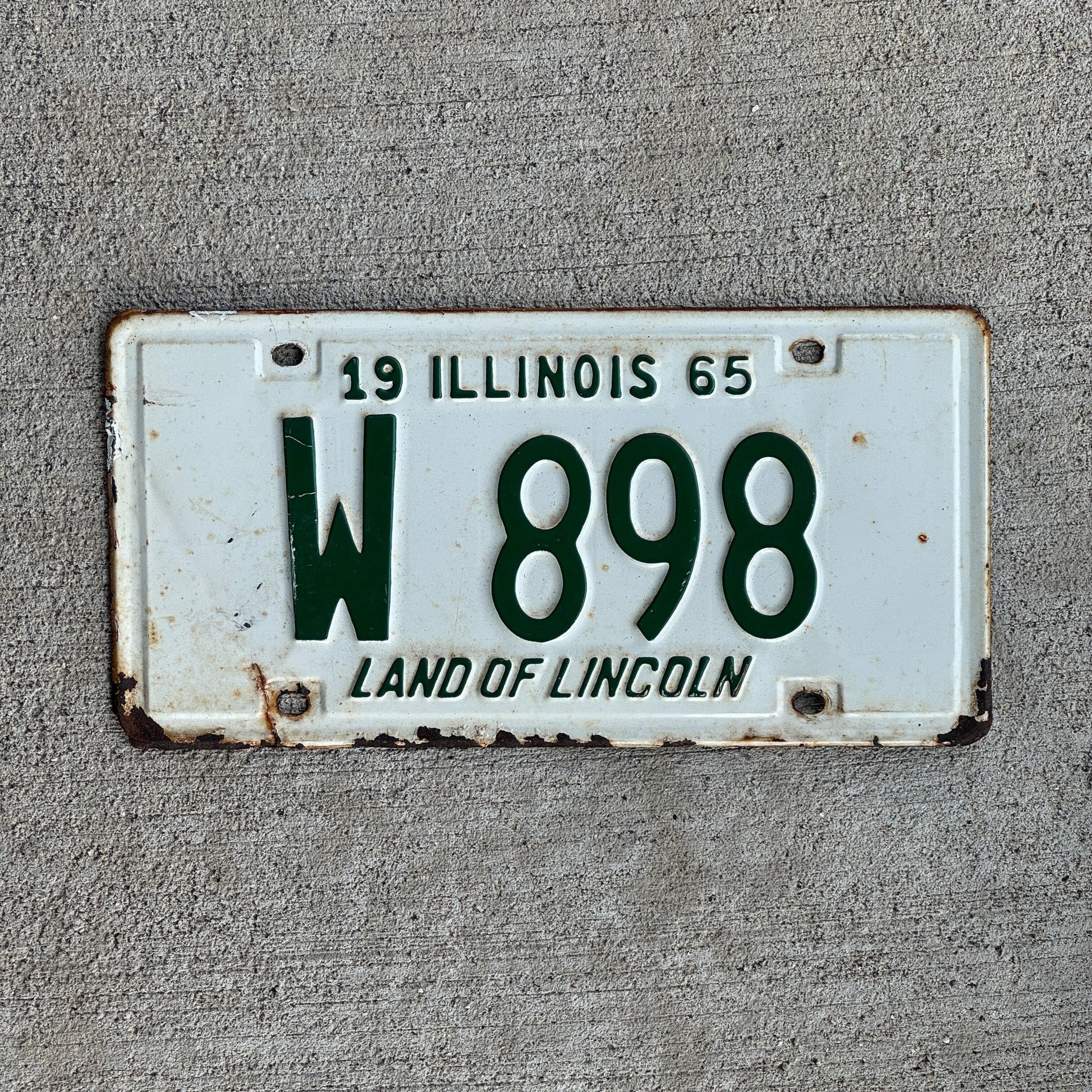 Photo of a 1965 Illinois Trailer License Plate Auto Tag Garage Decor Vintage Low Number Three Digit W 898 with original patina