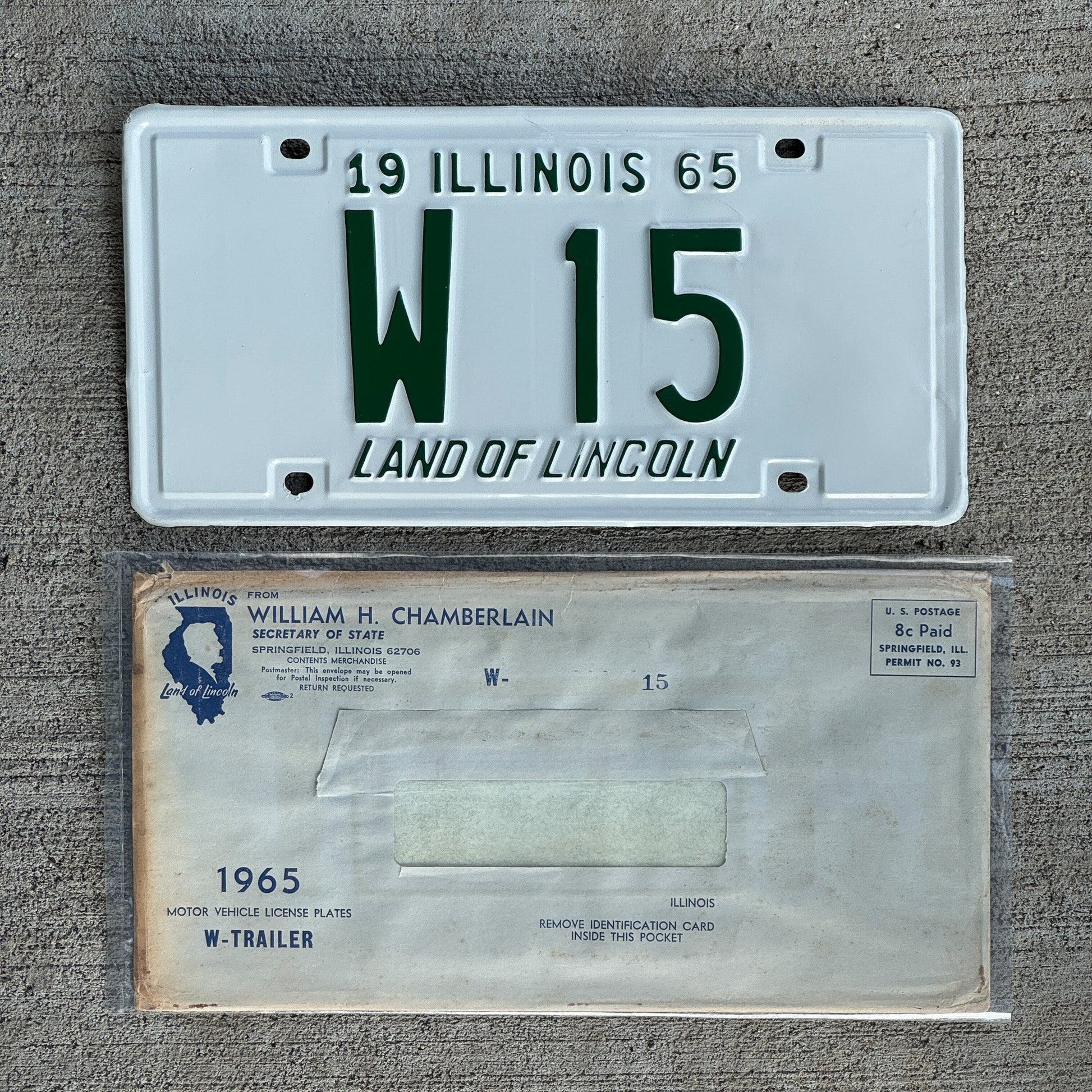 Photo of a 1965 Illinois Trailer License Plate Auto Tag Garage Decor Vintage Low Number Two Digit with Envelope W 15 with original patina