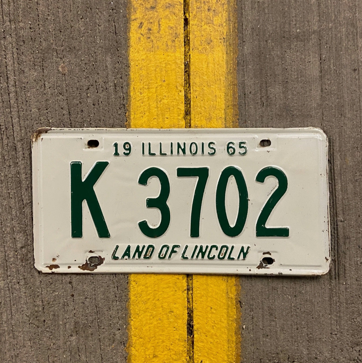 Photo of a 1965 Illinois Truck License Plate Auto Tag Garage Decor Vintage K 3702 with original patina
