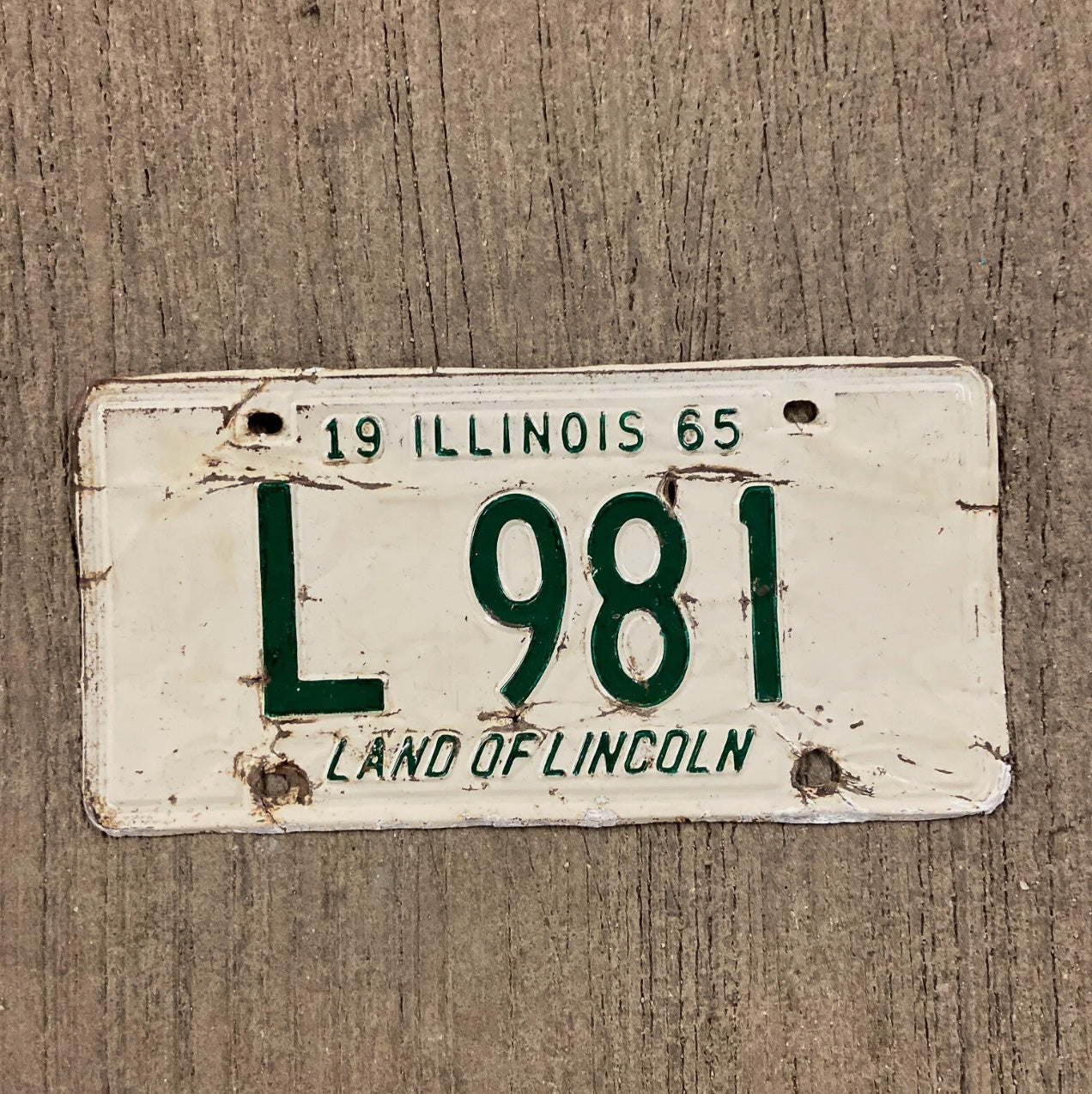 Photo of a 1965 Illinois Truck License Plate Auto Tag Garage Decor Vintage L 981 with original patina