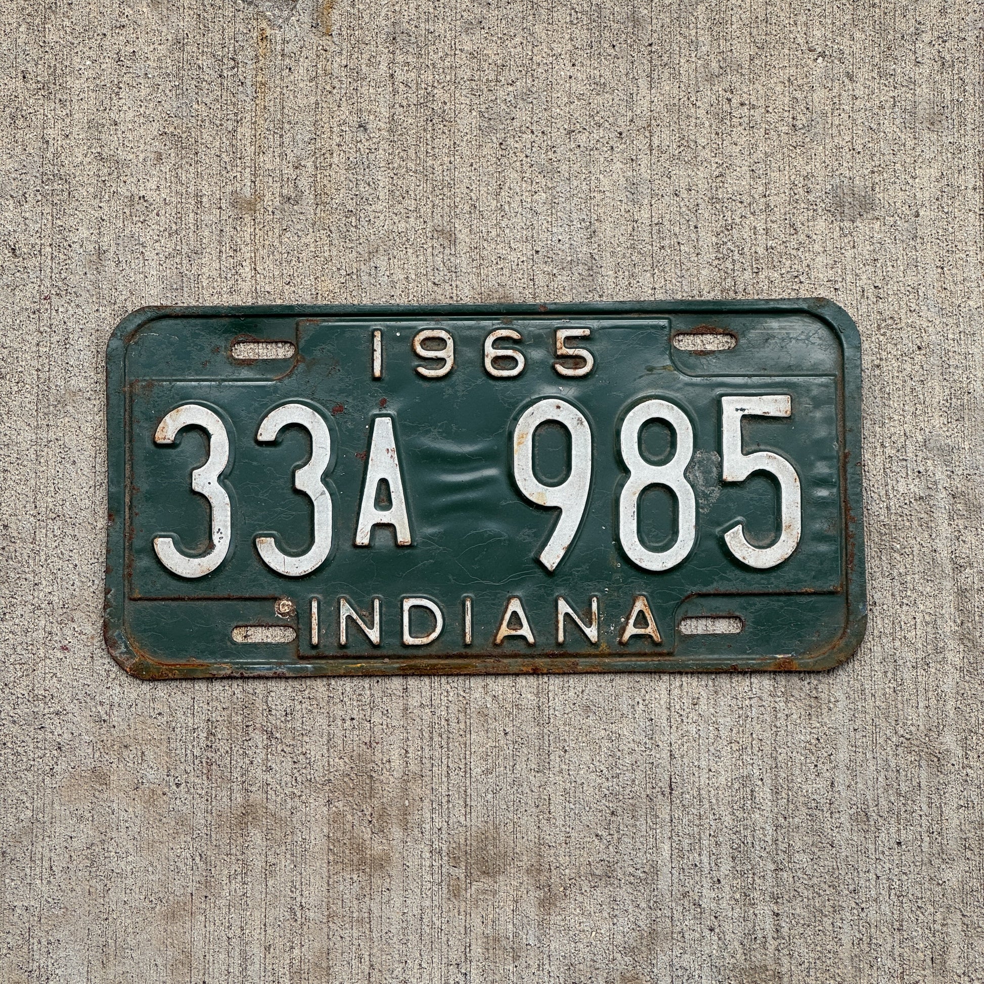 Photo of a 1965 Indiana License Plate Auto Tag Garage Decor Vintage 33 A 985 with original patina