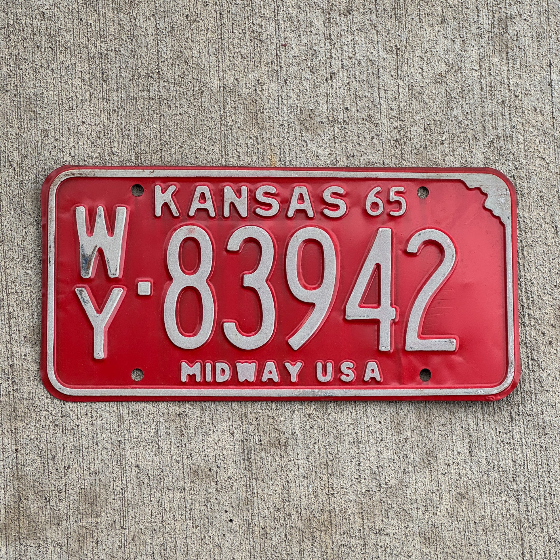 Photo of a 1965 Kansas License Plate Auto Tag Garage Decor Vintage WY 83942 with original patina
