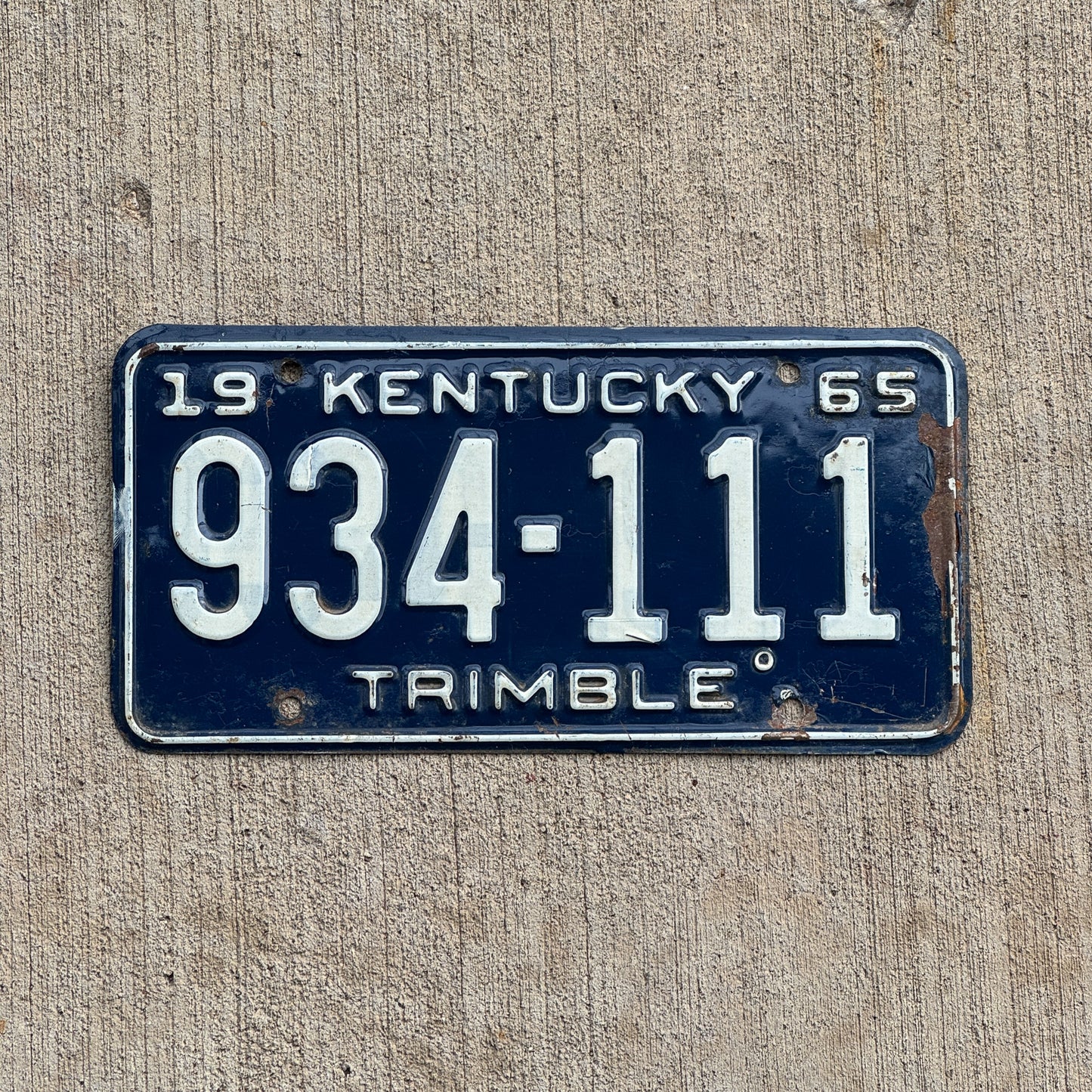 Photo of a 1965 Kentucky License Plate Auto Tag Garage Decor Vintage Repeat Repeating 934 111 with original patina