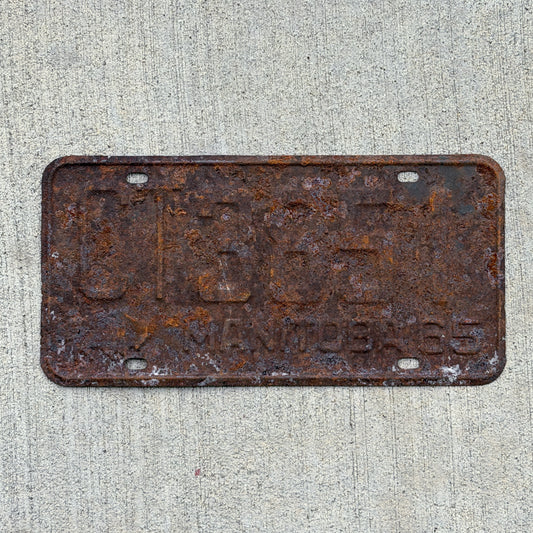 Photo of a 1965 Manitoba Commercial License Plate Auto Tag Garage Decor Vintage CT 3851 with original patina