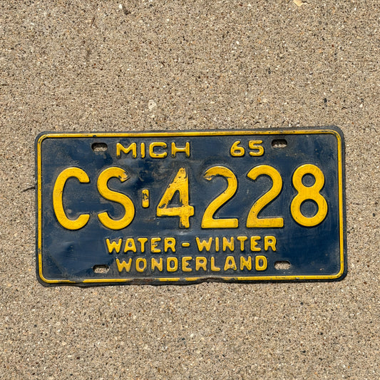 Photo of a 1965 Michigan License Plate Auto Tag Garage Decor Vintage CS 4228 with original patina