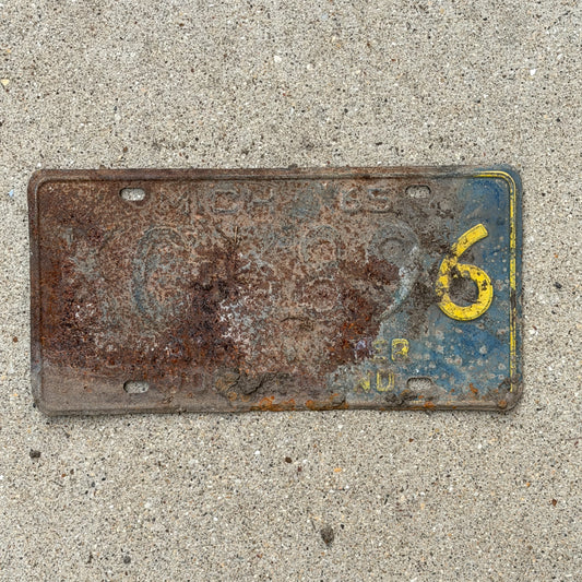 Photo of a 1965 Michigan License Plate Auto Tag Garage Decor Vintage KG 3896 with original patina