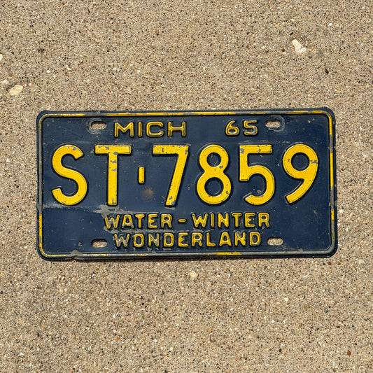 Photo of a 1965 Michigan License Plate Auto Tag Garage Decor Vintage ST 7859 with original patina