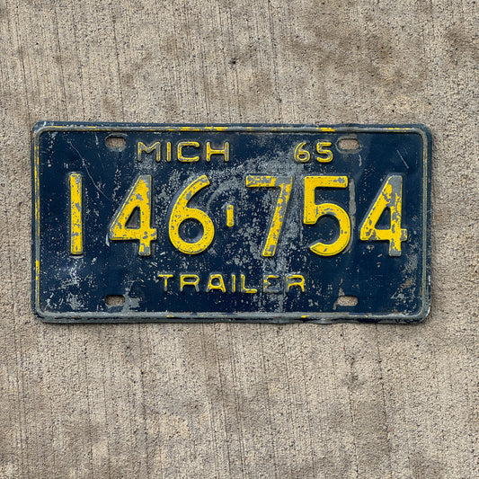 Photo of a 1965 Michigan Trailer License Plate Auto Tag Garage Decor Vintage 146 754 with original patina