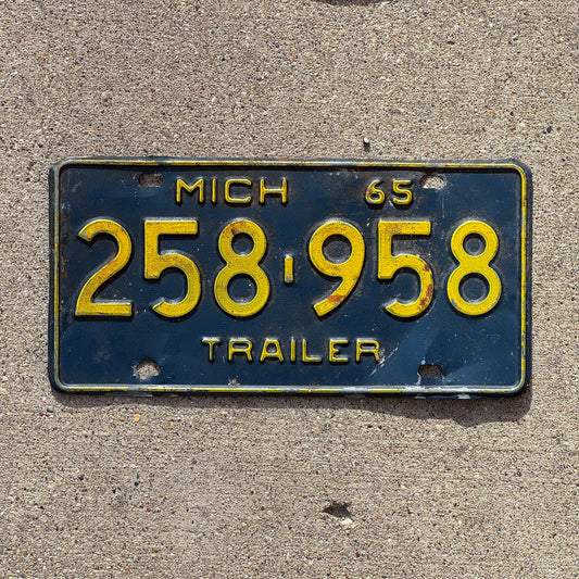 Photo of a 1965 Michigan Trailer License Plate Auto Tag Garage Decor Vintage 258 958 with original patina