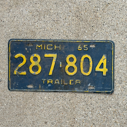Photo of a 1965 Michigan Trailer License Plate Auto Tag Garage Decor Vintage 287 804 with original patina