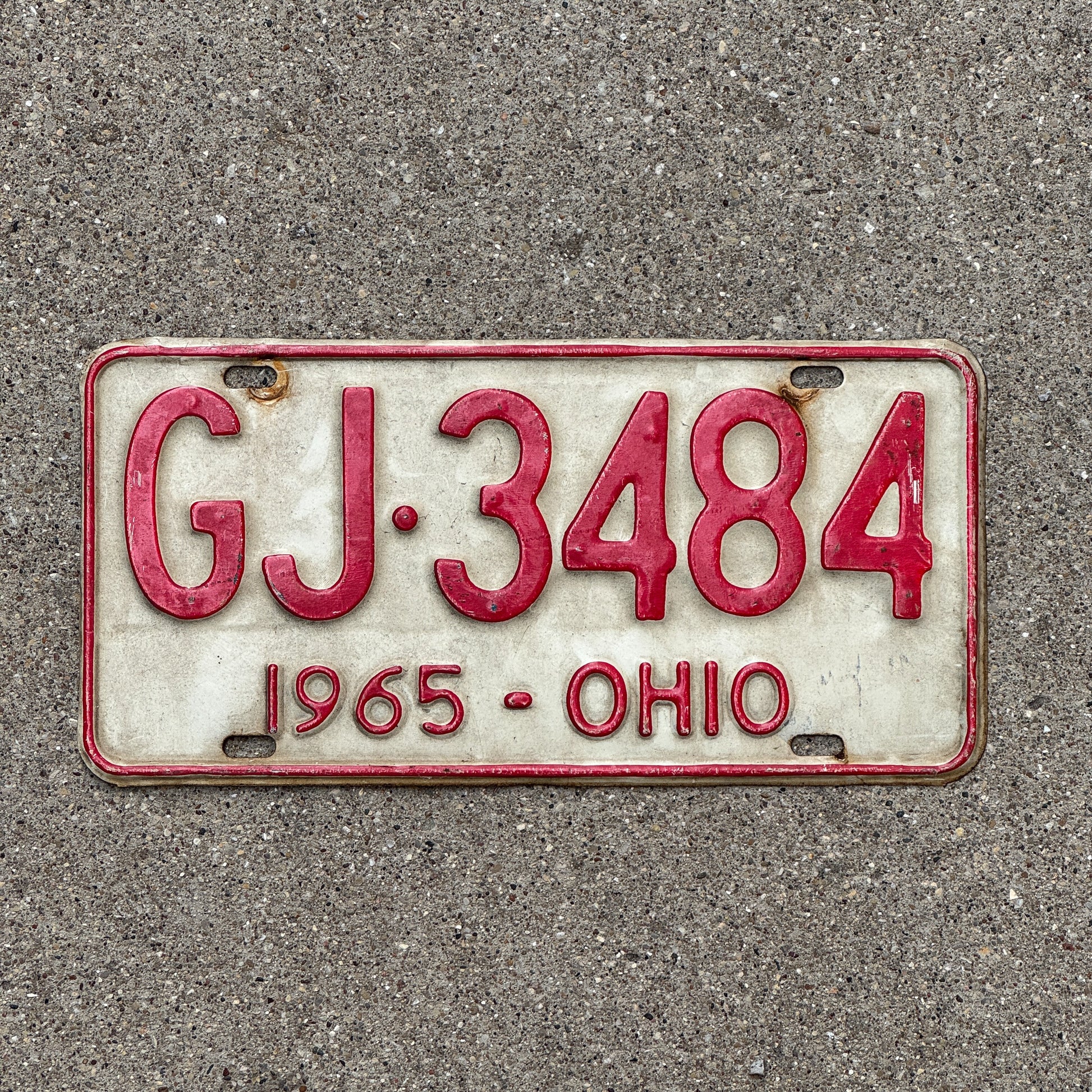 Photo of a 1965 Ohio License Plate Auto Tag Garage Decor Vintage GJ 3484 with original patina