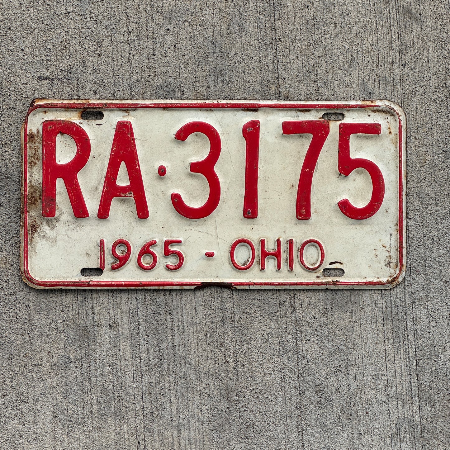 Photo of a 1965 Ohio License Plate Auto Tag Garage Decor Vintage RA 3175 with original patina